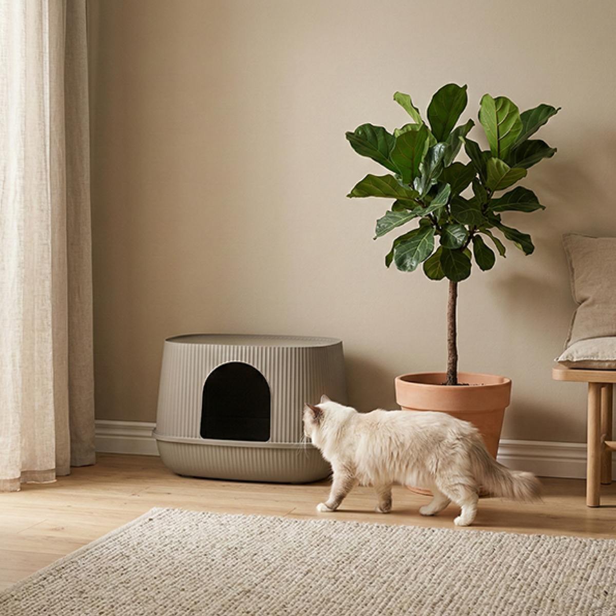Savic Moona warm grey hooded cat litter box with rounded shape, ribbed surface and front door opening.